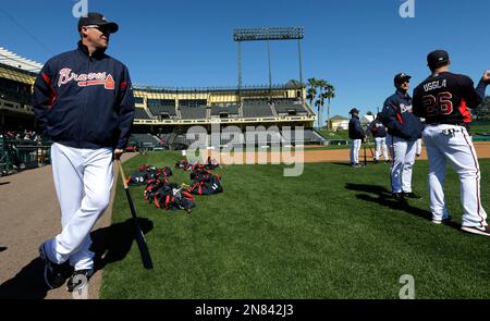 Atlanta Braves 1995 World Series champion teammates Chipper Jones, left,  and David Justice laugh before the third full squad spring training  baseball workout, Monday, Feb. 27, 2012, in Lake Buena Vista, Fla.