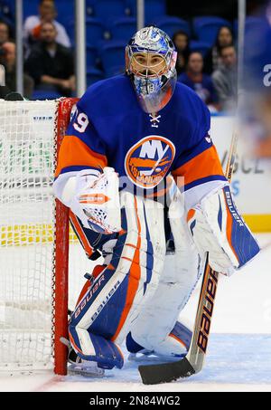 New York Islanders goalie Rick DiPietro deflects a shot against the ...