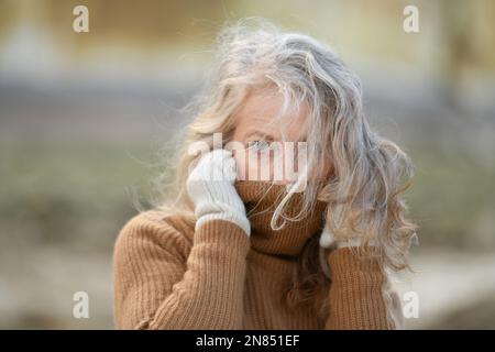 Portrait of a sixty-year-old woman with a gray hair Stock Photo