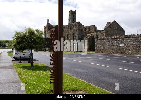 timoleague abbey Wave logo metal sign for wild atlantic way discovery points in Southern Ireland EIRE Stock Photo