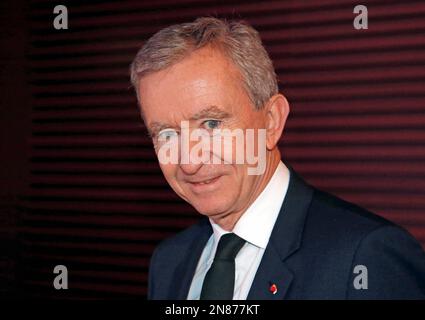 Tokyo, Japan. 21st Apr, 2016. (L to R) Bernard Arnault Chairman and CEO of  the luxury giant LVMH Moet Hennessy Louis Vuitton and his son Frederic  Arnault pose for the cameras during