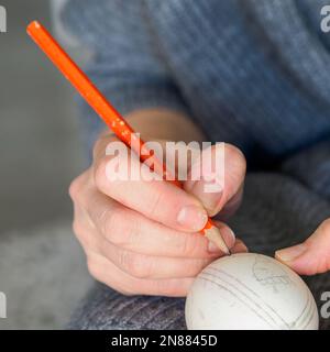 Decorating an Easter egg. Needlework. Traditional Easter customs in Poland. Stock Photo