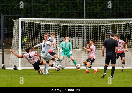 Swansea, Wales. 4 February 2023. Richard Faakye of Swansea City holds off  the challenge from Jack Howland of Millwall during the Professional  Development League game between Swansea City Under 18 and Millwall