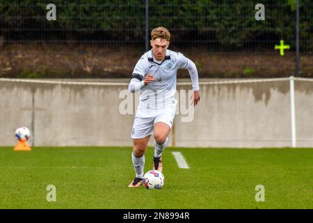 Swansea, Wales. 4 February 2023. Iwan Morgan of Swansea City high fives  Aimar Govea of Swansea City during the Professional Development League game  between Swansea City Under 18 and Millwall Under 18