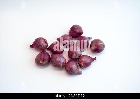 Shallots isolated on white background. Important ingredient used in Asian cuisine to provide aroma and flavor. Stock Photo