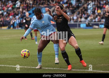 Citys Khadija Shaw battles with Arsenals Rafaelle Souza during the Barclays FA Women's Super League match between Manchester City and Arsenal at the Academy Stadium, Manchester on Saturday 11th February 2023. (Photo: Chris Donnelly | MI News) Credit: MI News & Sport /Alamy Live News Stock Photo