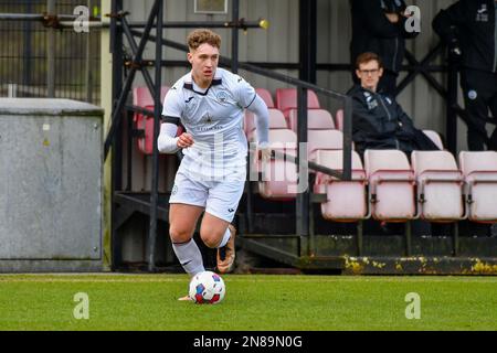 Swansea, Wales. 4 February 2023. Iwan Morgan of Swansea City high fives  Aimar Govea of Swansea City during the Professional Development League game  between Swansea City Under 18 and Millwall Under 18