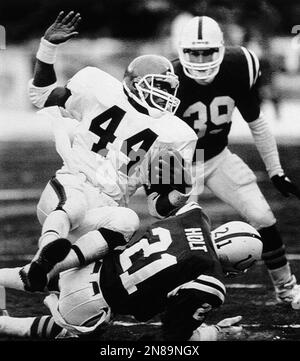 Cleveland Browns running back Earnest Byner (44) is hauled down in his  backfield by the New York Jets Marty Lyons (93) at his feet and Mark  Gastineau at his rear as Johnny