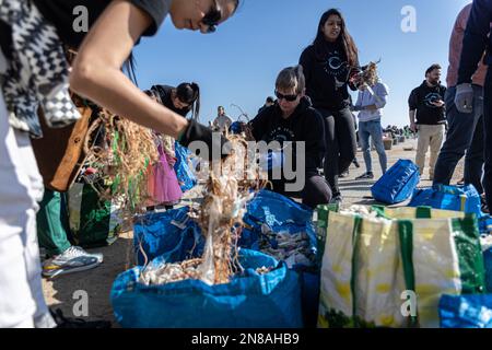 Barcelona, Spain. 11th Feb, 2023. A group of volunteers separates all the waste they have collected to recycle it. The Clean Beach Initiative is an organization established in 2018 to protect the environment by cleaning beaches and preventing ocean pollution. (Photo by Axel Miranda/SOPA Images/Sipa USA) Credit: Sipa USA/Alamy Live News Stock Photo