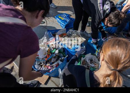 Barcelona, Spain. 11th Feb, 2023. A group of volunteers separates all the waste they have collected to recycle it. The Clean Beach Initiative is an organization established in 2018 to protect the environment by cleaning beaches and preventing ocean pollution. (Photo by Axel Miranda/SOPA Images/Sipa USA) Credit: Sipa USA/Alamy Live News Stock Photo