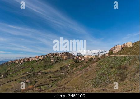 View of Polizzi Generosa village among the snow-capped peaks of the Madonie, Sicily Stock Photo