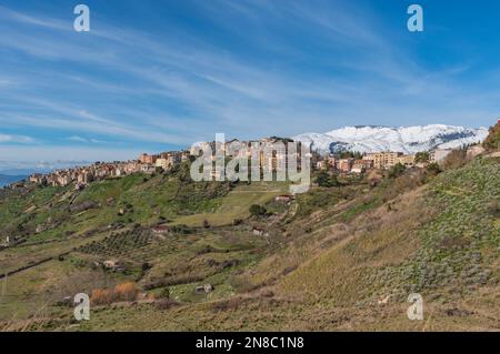 View of Polizzi Generosa village among the snow-capped peaks of the Madonie, Sicily Stock Photo