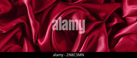 Monochrome crumpled fabric in the color of the year 2023 viva magenta, top view,flat lay Stock Photo