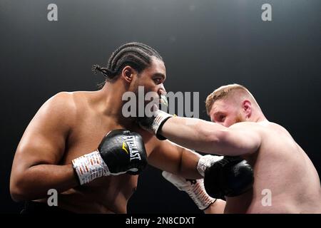 Jeamie 'TKV' Tshikeva (left) in action against Harry Armstrong in the heavyweight contest at the OVO Wembley Arena, London. Picture date: Saturday February 11, 2023. Stock Photo