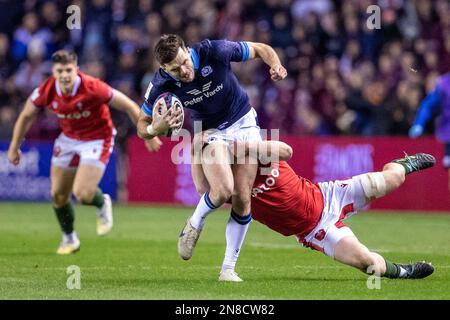 Edinburgh, UK. 11th Feb, 2023. 11th February 2023; Murrayfield Stadium, Edinburgh, Scotland: Six Nations International Rugby, Scotland versus Wales; Blair Kinghorn of Scotland is tackled Credit: Action Plus Sports Images/Alamy Live News Stock Photo