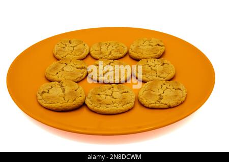 Peanut Butter cookies on a orange plate on a white background Stock Photo