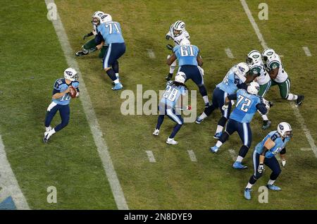 Tennessee Titans quarter back Jake Locker (10) runs against the Miami  Dolphins during first half action at Sun Life Stadium November 11, 2012 in  Miami, Florida. The Titans beat the Miami Dolphins37-3