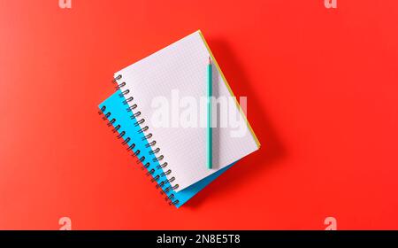 Spring Notebook Empty Mockup. An empty A4 notebook with a spiral spring on woode background ...