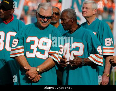 Miami Dolphins fullback Larry Csonka (39) grinds out the yardage in their  game against the Buffalo Bills at The Orange Bowl in Miami, Fla., Oct. 22,  1972. Making the stop in the