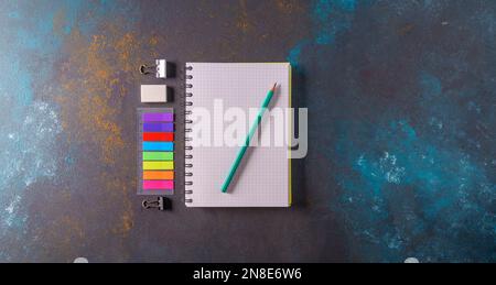 Mockup. An empty A4 notebook with a spiral spring on blue background, top view,flat lay Stock Photo