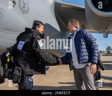 Adana, Turkey. 08th Feb, 2023. U.S. Ambassador to Turkey Jeffry Flake, right, greets USAID rescue workers as they arrive at Incirlik Air Base, February 8, 2023 in Adana, Turkey. The Disaster Assistance Response Team arrived to join the search and rescue operations following a massive earthquake that struck central-southern Turkey and northern Syria. Credit: SrA David McLoney/US Air Force Photo/Alamy Live News Stock Photo