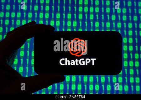 Digital composite of Microsoft ChatGPT OpenAI chatbot logo on phone screen Stock Photo