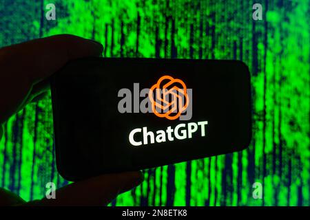 Digital composite of Microsoft ChatGPT OpenAI chatbot logo on phone screen Stock Photo