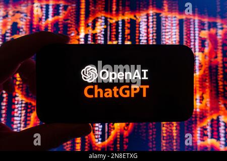 Digital composite of Microsoft ChatGPT OpenAI chatbot logo on phone screen Stock Photo