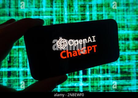 Digital composite of Microsoft ChatGPT OpenAI chatbot logo on phone screen Stock Photo