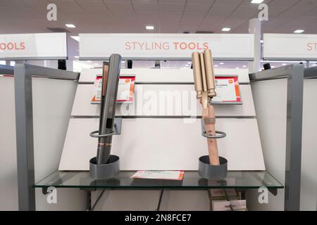 Two personal care hair styling products, curling irons or wave iron, in a store display. Kansas, USA. Stock Photo