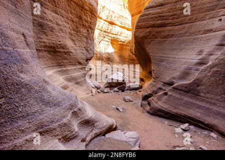 Barranco de Las Vacas slot canyon with rocks on the ground. The canyon is very similar to the Navajo Upper Antelope Canyon. Stock Photo