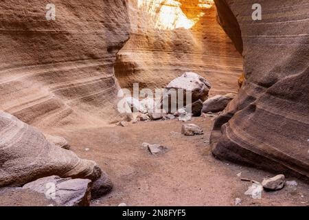 Barranco de Las Vacas slot canyon with rocks on the ground. The canyon is very similar to the Navajo Upper Antelope Canyon. Stock Photo