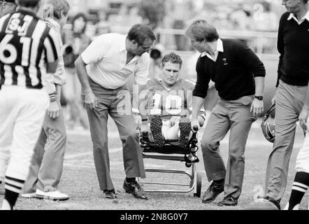 Atlanta Falcons quarterback Steve Bartkowski (10) goes down and loses the  ball as Los Angeles Rams linebacker Joe Harris sacks Bartkowski during the  overtime period in Anaheim, Dec. 21, 1980. The Rams