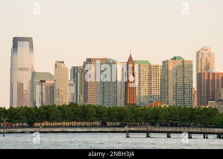 Hoboken terminal and Jersey City skyline, Hudson river waterfront, New Jersey, USA Stock Photo