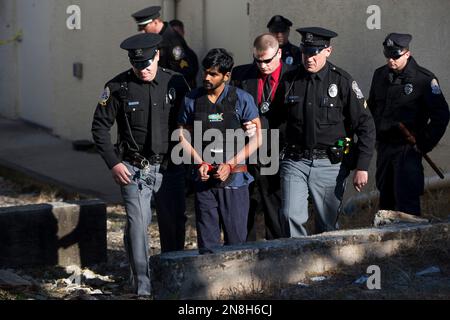 Raghunandan Yandamuri is escorted from a Montgomery County district court after a preliminary hearing Wednesday, Nov. 28, 2012, in Bridgeport, Pa. Investigators said Yandamuri killed 10-month-old Saanvi Venna and her grandmother Satyavathi Venna in a botched ransom kidnapping. He is being held without bail on murder, kidnapping and other charges. (AP Photo/Matt Rourke)