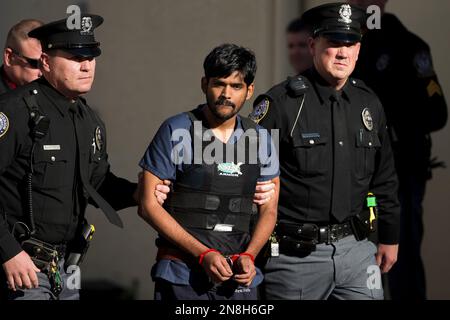 Raghunandan Yandamuri is escorted from a Montgomery County district court after a preliminary hearing Wednesday, Nov. 28, 2012, in Bridgeport, Pa. Investigators said Yandamuri killed 10-month-old Saanvi Venna and her grandmother Satyavathi Venna in a botched ransom kidnapping. He is being held without bail on murder, kidnapping and other charges. (AP Photo/Matt Rourke)