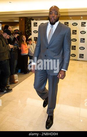 The New York Jets' Bart Scott models an outfit during a charity