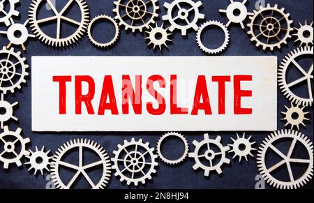 Translate message on a desk in a bright living room in the background Stock Photo