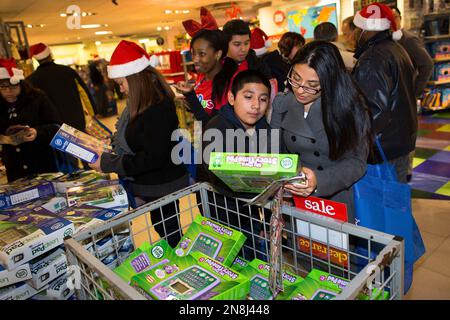 Shoppers browse LeapFrog products in the Times Square Toys R Us