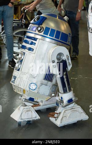 Replica of popular robot R2D2 from the film Star Wars, at the London Film Comic Con,  held at Olympia London exhibition and event venue. Stock Photo