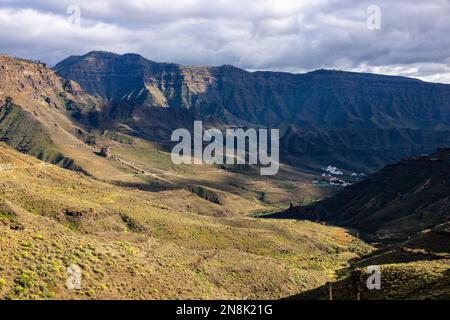 view of the majestic rise of a volcanic mountain clear day, clouds. Green bushes. No people. Stock Photo