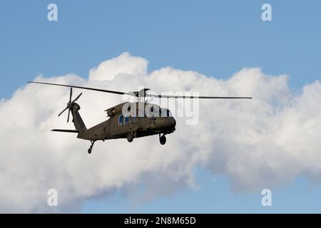 A US Army Sikorsky UH-60 Black Hawk helicopter flying near Naval Air Facility, Atsugi airbase, Kanagawa, Japan. Stock Photo