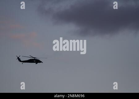 A Sikorsky SH-60 Seahawk helicopter with the US Navy Helicopter Maritime Strike Squadron (HSM-51, the War Lords) flying near NAF Atsugi, Japan Stock Photo