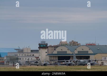 US Navy aircraft such as Seahawk helicopters, F18 Super Hornets and C130 Hercules transport aircraft at NAF Atsugi Airbase Kanagawa, Japan Stock Photo