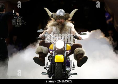 Minnesota Vikings mascot Ragnar rides onto the field in front of