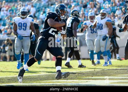 Jacksonville Jaguars running back Rashad Jennings (23) wards off