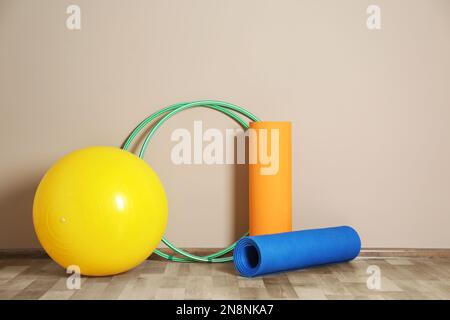 Sports equipment for yoga classes is on the shelf in the gym Stock Photo