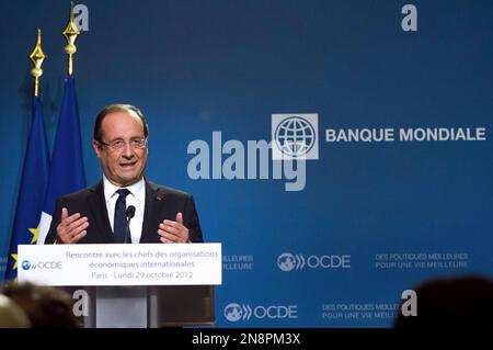 France's President Francois Hollande delivers a speech during a press conference after a general meeting at the OECD headquarters in Paris, Monday Oct. 29, 2012. (AP Photo/Bertrand Langlois, Pool)