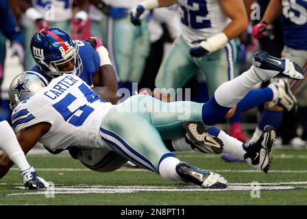 Photo: Dallas Cowboys Gerald Sensabaugh tackles New York Giants Bear Pascoe  at MetLife Stadium in New Jersey - NYP20120101112 