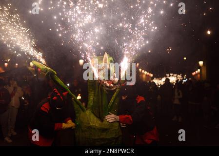 Barcelona, Spain. 11th Feb, 2023. Attendees take part during the event. The traditional Catalan procession of Correfocs is seen in the city center during the celebrations for Santa Eulalia festivity. Correfocs is a tradition of the Catalan folklore where people dressed as evils run in the streets with pitchforks with fireworks on them. Credit: SOPA Images Limited/Alamy Live News Stock Photo